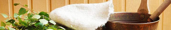 Towel and bucket in sauna