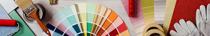 Various painting supplies and color swatches