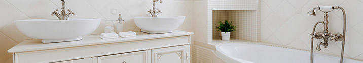 White bathroom with white bathtub and sinks