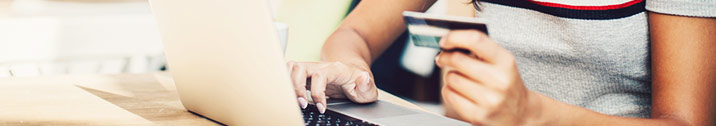 Woman checking credit card statement online