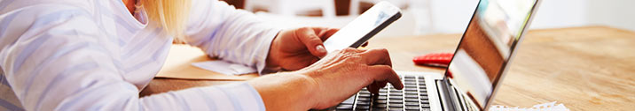 Woman on phone and laptop