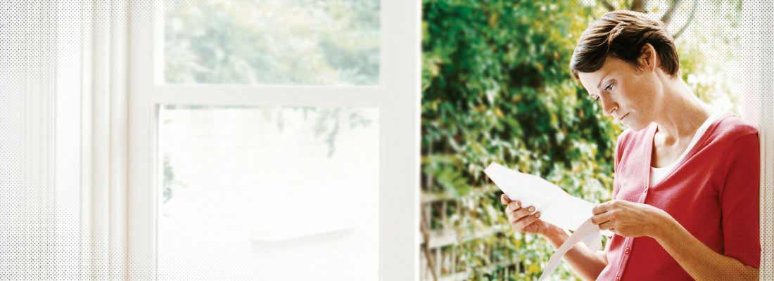 Woman reading bill