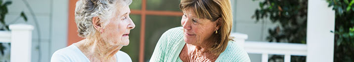 Woman talking to elderly mother