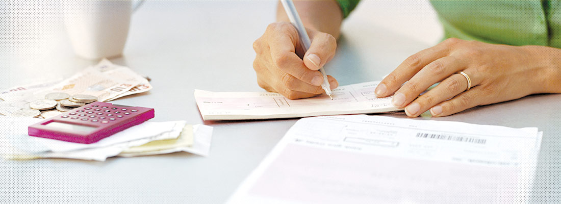 Woman writing a check