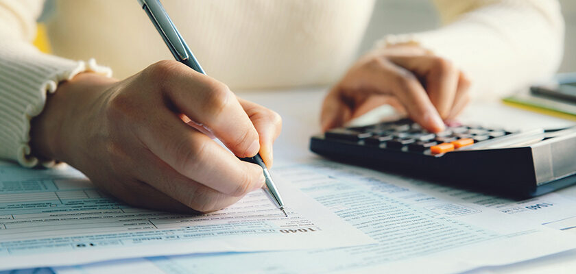 accountant filing tax paperwork