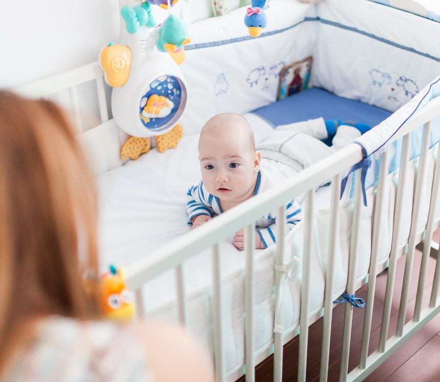 When should babies sleep in their own rooms?