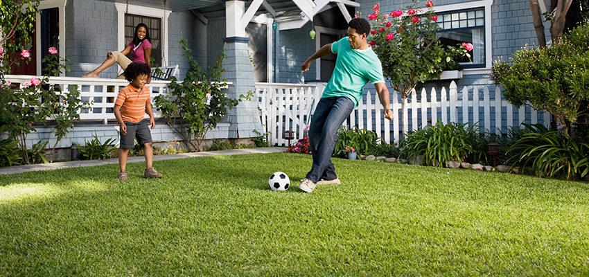 family playing soccer
