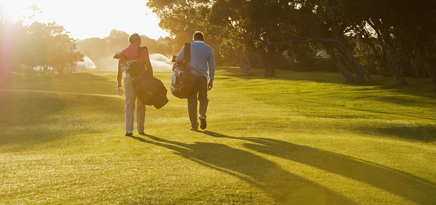 friends walking in golf course