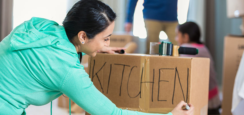 woman labeling box
