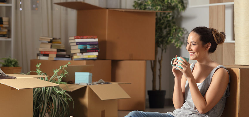 woman leaning against box
