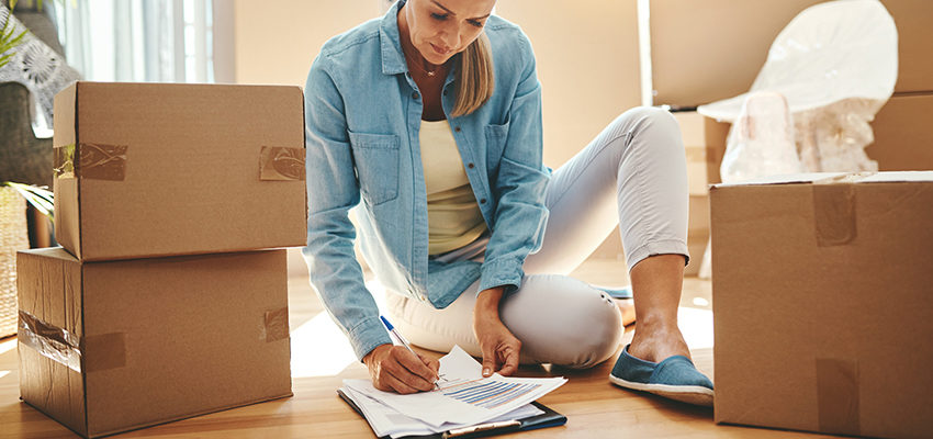 woman marking to do list