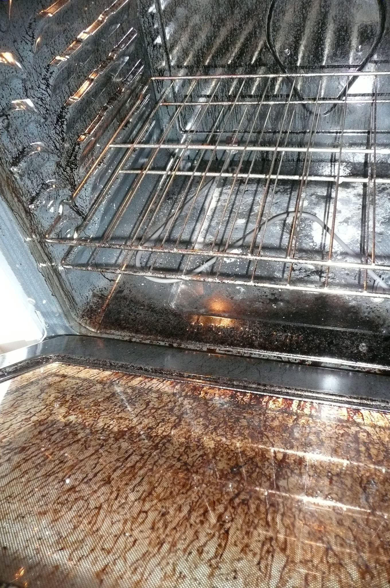 How do you manually clean a Kenmore oven?