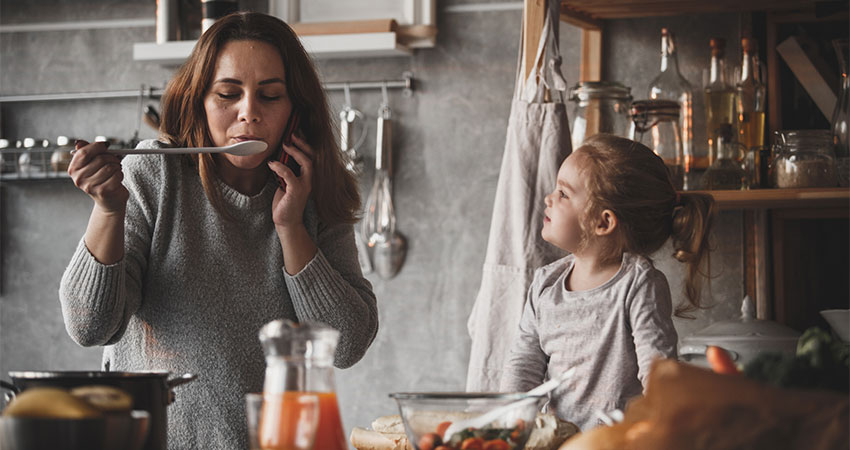 family cooking in kitchen